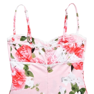 Close-up of pink floral top with red roses, white lace trim and adjustable straps