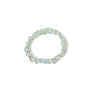 Mint green and beige ribbed fabric elastic hair tie with resin accent on white background