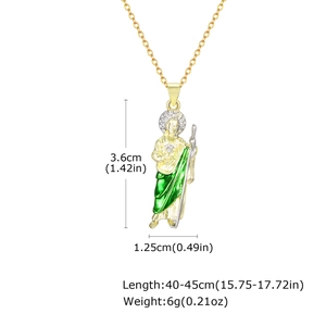 Detailed view of St. Jude religious pendant with green enamel and gold finish details