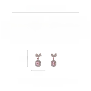 Detailed view of pink crystal bow earrings with rhinestone alloy finish and dimensions