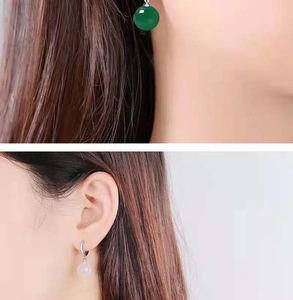 Close-up of natural green agate and white chalcedony ball dangle earrings for women
