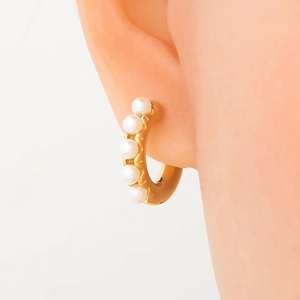 French style 18k gold plated stainless steel earrings with five white pearls on model