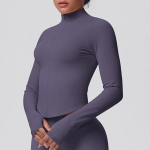 Detail of greyish-purple yoga jacket showing stand collar, zipper and thumbhole cuffs