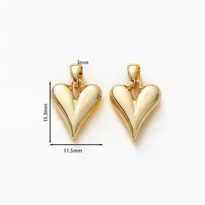 Detail of 18K gold-plated heart charms with 15.3mm height and mirror-polished surface