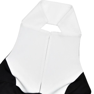 Detail of contrast lapel collar with neck cutout on a black and white slim maxi dress
