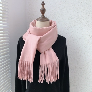 Close-up of pink imitation cashmere scarf featuring soft texture and elegant fringe detail
