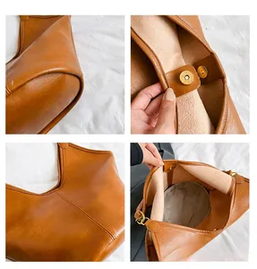 Detail view of brown leather bag showing gold magnetic clasp and precise stitching