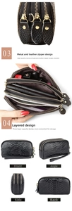 Detailed view of black snake pattern clutch featuring three zippers and wristlet strap