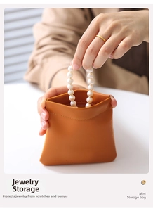 Mini orange-brown PU leather pouch storing a pearl necklace for protection