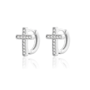 Polished silver huggie earrings with sparkling zircon-encrusted cross pendants on white
