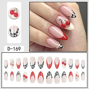 Almond shaped press-on nails featuring French leopard print and 3D cherry accents