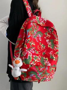 Traditional red Northeast China floral backpack with a cute white duck pendant