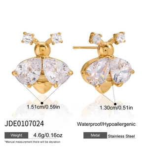 Detailed view of 18K gold bee earring featuring white zircon wings and stainless steel