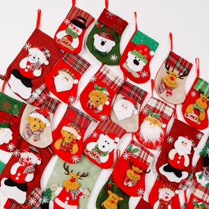 Christmas stockings set with Santa and reindeer patterns for holiday tree decorations