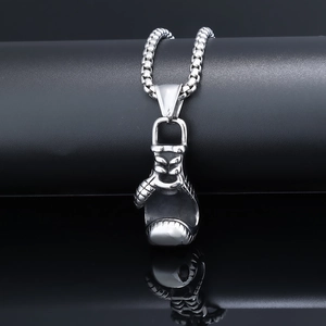 Detail shot of the polished silver boxing glove pendant and bead chain for men