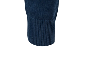 Macro detail of high-density ribbed knit cuffs on a navy blue cotton men sweater