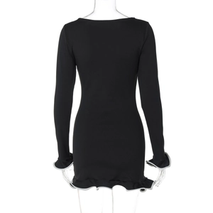 Rear view detail of black bodycon dress featuring grey ruffled hems on sleeves and bottom