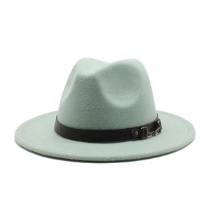 Detailed close-up of light mint green wool fedora hat with brown leather belt and metal chain