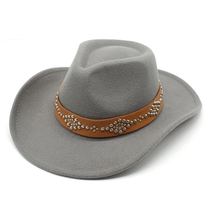 Detail shot of a grey wool felt cowboy hat featuring a brown studded leather band
