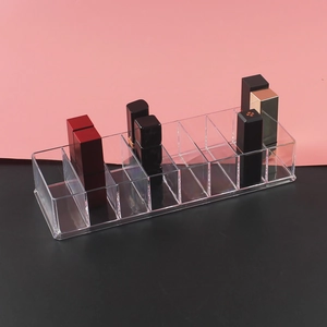 Detailed view of clear acrylic 10-slot lipstick organizer and makeup storage display