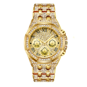 Luxury gold men's watch with full crystal diamonds and octagonal bezel on white background