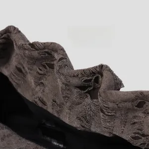 Close-up of distressed bucket hat brim with memory wire for adjustable styling