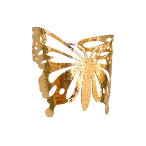 Polished gold butterfly hollow cuff bracelet with textured metallic finish and open design