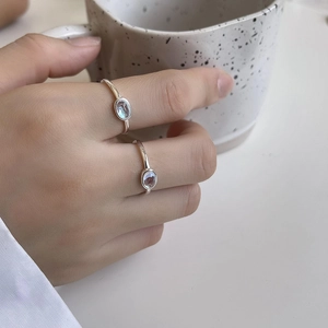 Minimalist 925 sterling silver open ring set with light blue oval moonstone on fingers