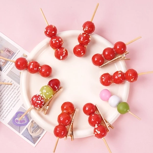 Funny realistic food hair clips featuring sugar-coated haws and tricolor dango on a gold clip