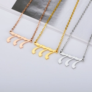 Detailed view of angel number 777 necklaces in rose gold, gold and silver finishes