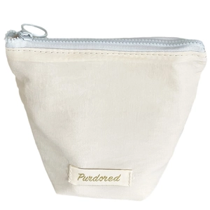 Creamy beige nylon cosmetic pouch with light blue zipper and branded label