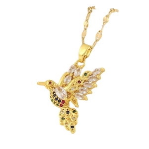 Golden hummingbird necklace with multicolor zircons on a flat water wave chain