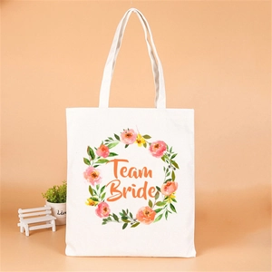White canvas tote bag with floral wreath and Team Bride print for bachelorette party