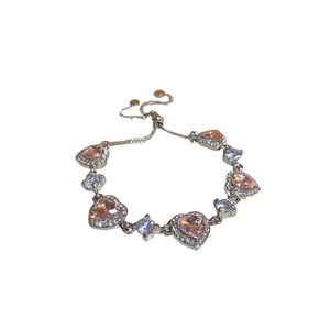 Elegant silver heart bracelet with pink zircon stone and adjustable sliding clasp design