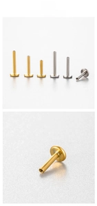 Macro detail of various sizes of gold and silver stainless steel flat back ear studs
