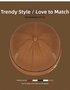 Detail of a brown canvas docker cap featuring high-quality English letter embroidery