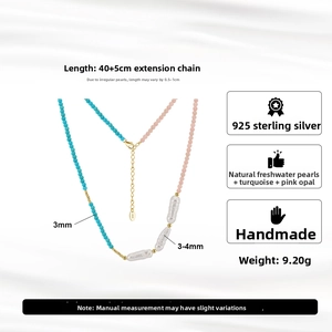 Detail of 925 silver necklace with natural freshwater pearls and turquoise beads