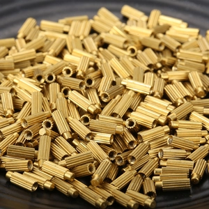Knurled brass threaded inserts cylindrical hardware components for industrial assembly
