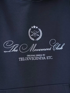 Navy blue oversized hoodie featuring white embroidered The Movement Club letter print