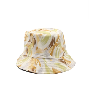 Reversible bucket hat with abstract floral feather print for outdoor sun protection