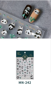 Macro detail of panda and bamboo nail stickers with gold outlines on nude manicure