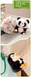 Close-up of fluffy elephant, panda, and penguin plush charms on a bag with gold metal clips
