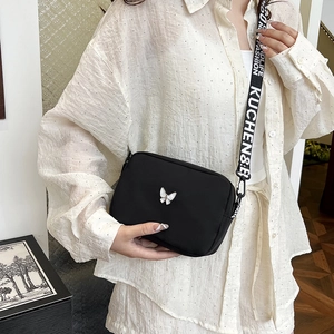 Fashionable black nylon crossbody bag with butterfly buckle and wide logo shoulder strap