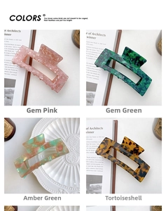 Detail showing four square cutout hair claws in marble and tortoiseshell acetate patterns