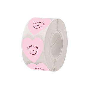 Pink heart-shaped thank you sticker roll with smiley face for gift packaging and scrapbooking