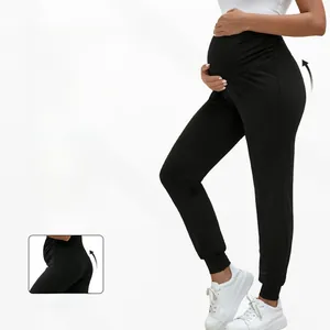 Detail of high-waist maternity joggers showing butt-lifting cut and flexible fabric