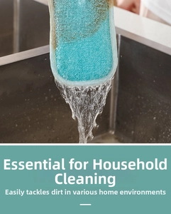 Detail of teal fiber cleaning sponge rinsing under running water in a steel sink