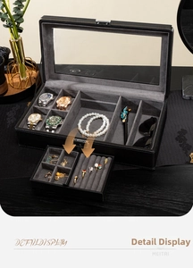 Detail der multifunktionalen Uhrenbox aus schwarzem Leder mit abnehmbarem Schmucktablett