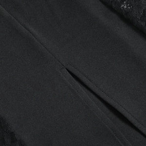 Detailed close-up of the black lace stitching and slit design on this sexy bodycon dress