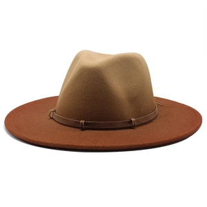 Two-tone wool fedora hat with wide brim in camel and brown colors with leather band